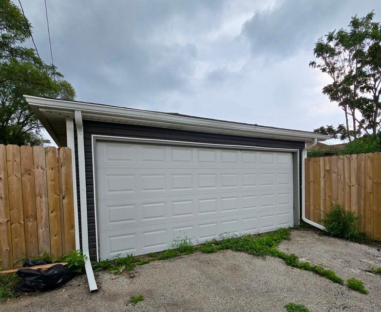1379 Roosevelt Place, Unit 1 Gary, IN 46404 - Photo 24 of 24 a couple of potted plants in front of door