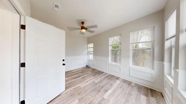 a view of an empty room with a window