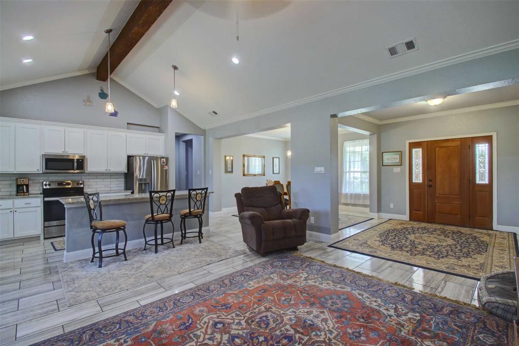8789 Hutcheson Hill Road Springtown, TX 76082 - Photo 7 of 29 Foyer featuring tiled floors, beam ceiling, high vaulted ceiling, recessed lighting, and a ceiling fan