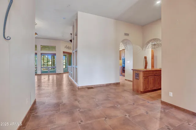 an aerial view of residential houses with outdoor space and parking