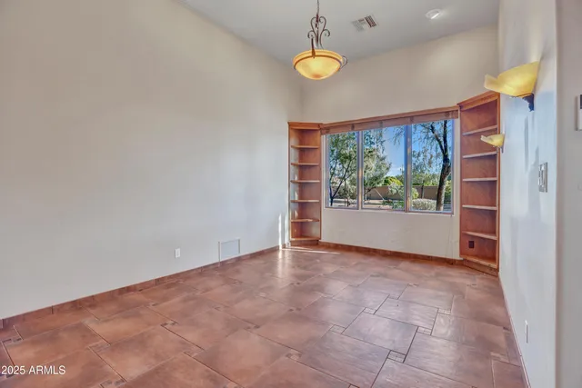 a view of a patio with couches table and chairs and potted plants