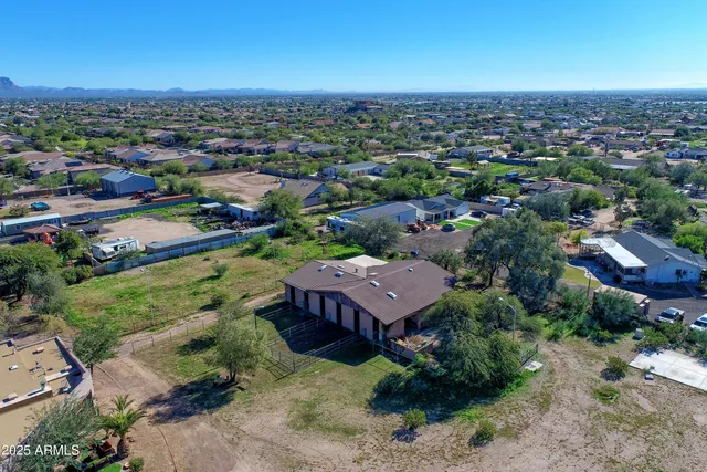 a view of a house with a tree in the background