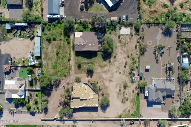 a view of a yard with yellow lighting