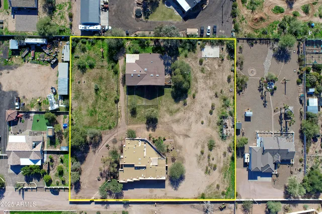 a backyard of a house with lots of green space and garden