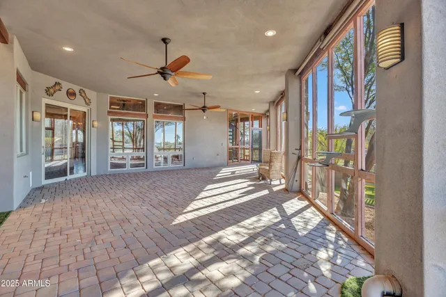 a kitchen with stainless steel appliances granite countertop a refrigerator and a stove