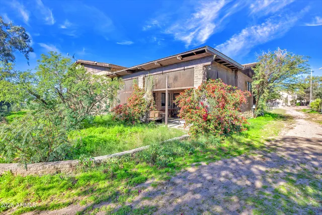 a view of a livingroom with a fireplace and cabinet
