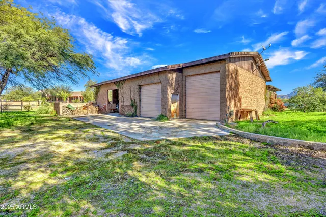 a large kitchen with stainless steel appliances granite countertop a large kitchen island and a stove