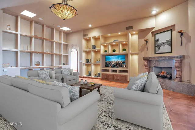 a view of a chairs and table in a backyard