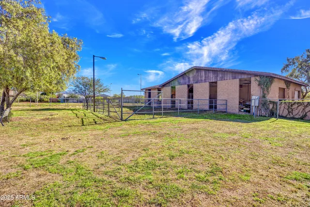 a view of a kitchen with furniture and a large window