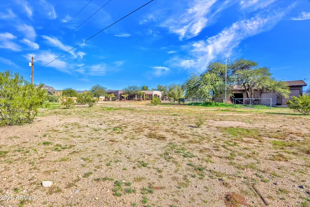 a kitchen with kitchen island granite countertop stainless steel appliances sink and cabinets