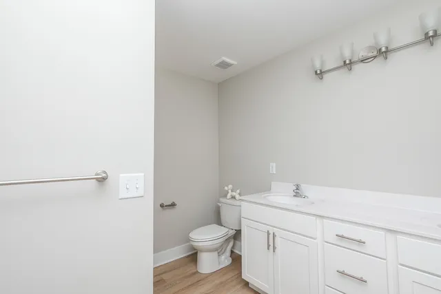 a bathroom with a sink toilet tub and shower