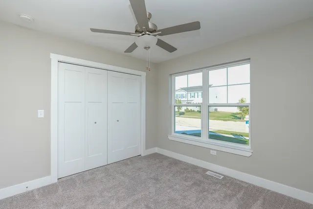 a view of empty room with wooden ceiling