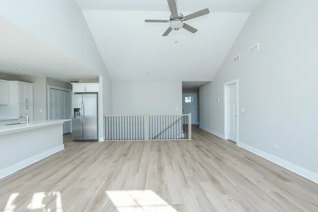 a view of kitchen with sink microwave and stove