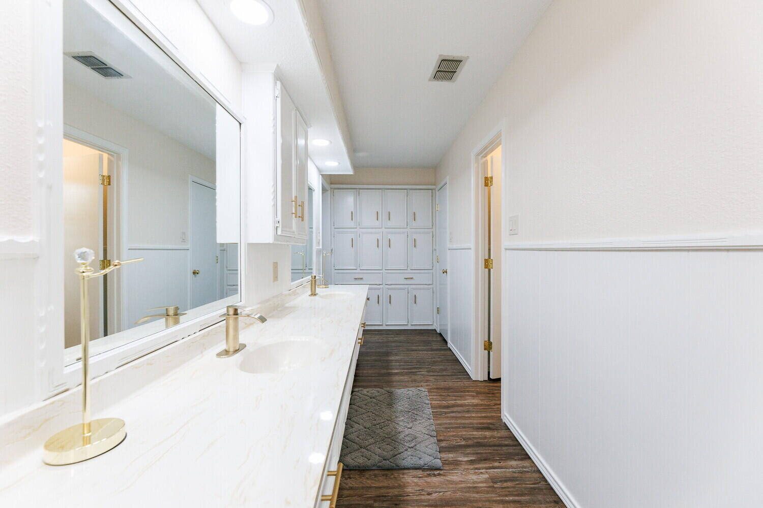 5703 80th Street Lubbock, TX 79424 - Photo 28 of 52 a bathroom with a sink and a mirror