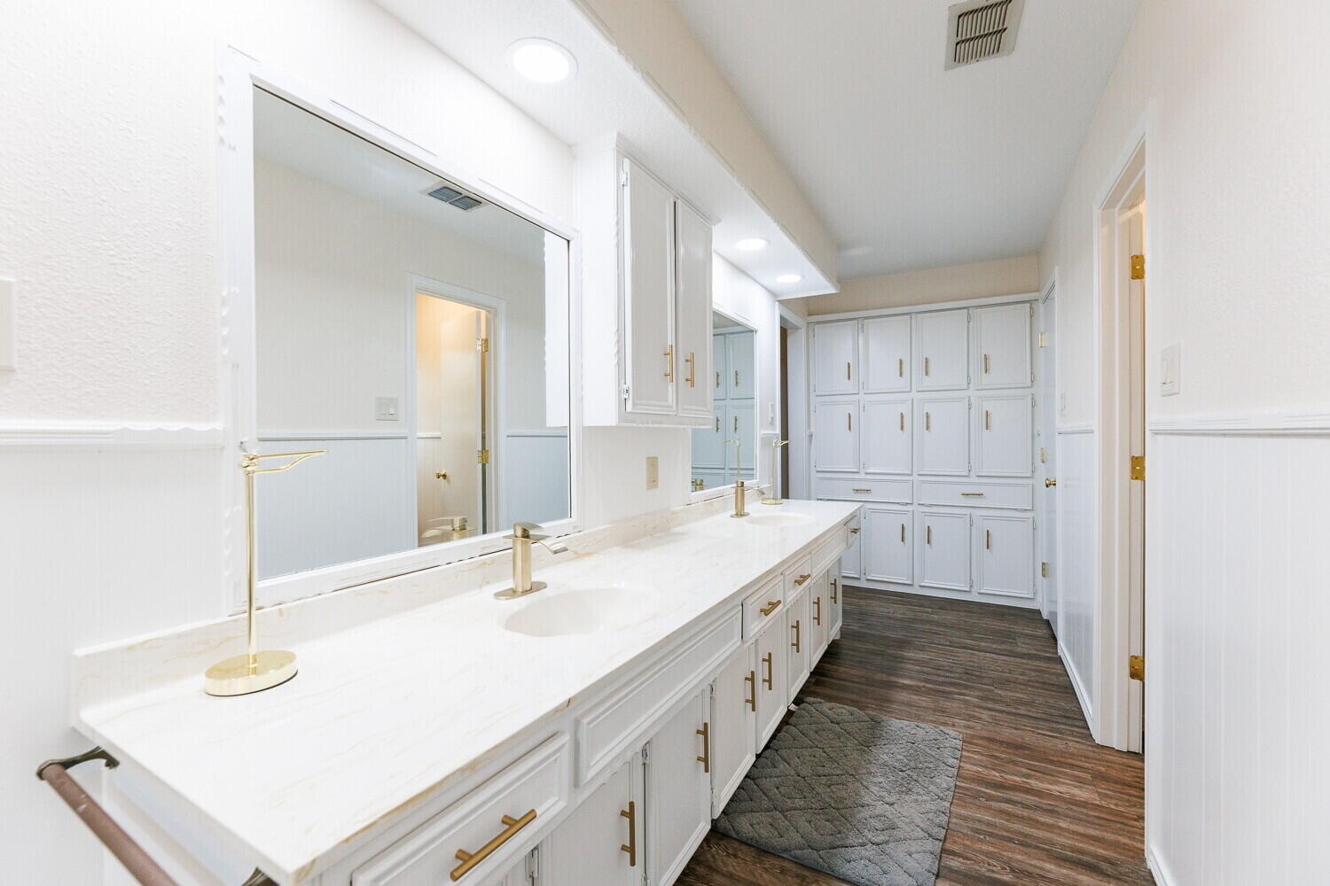 5703 80th Street Lubbock, TX 79424 - Photo 29 of 52 a spacious bathroom with double vanity and mirrors