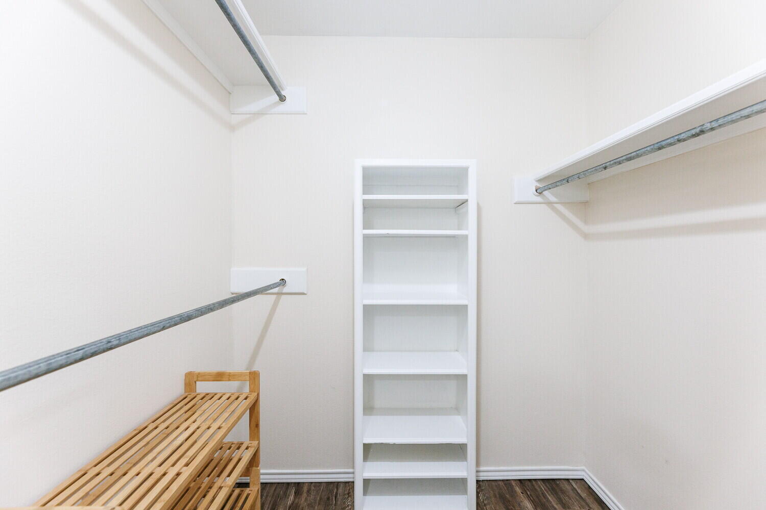 5703 80th Street Lubbock, TX 79424 - Photo 30 of 52 a view of walk in closet with empty racks