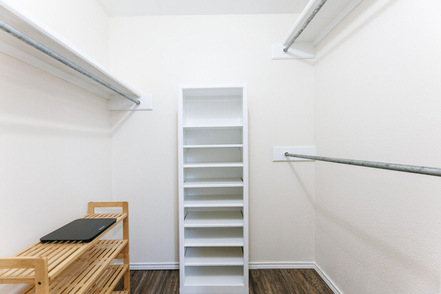 5703 80th Street Lubbock, TX 79424 - Photo 33 of 52 a view of walk in closet with empty racks