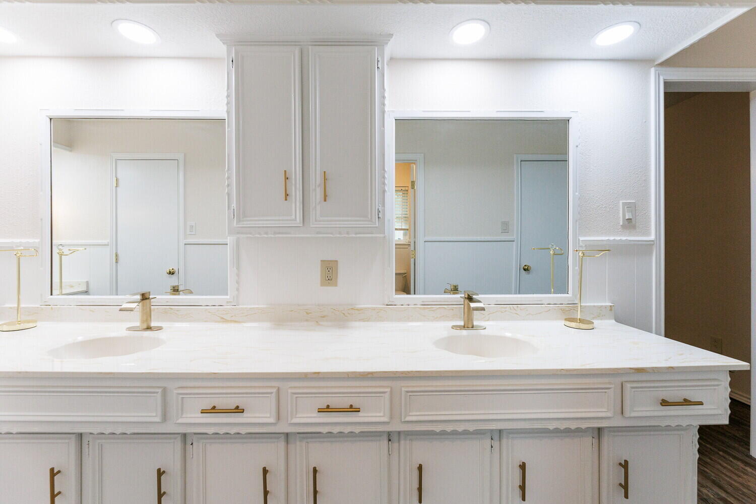 5703 80th Street Lubbock, TX 79424 - Photo 34 of 52 a bathroom with a sink and a mirror