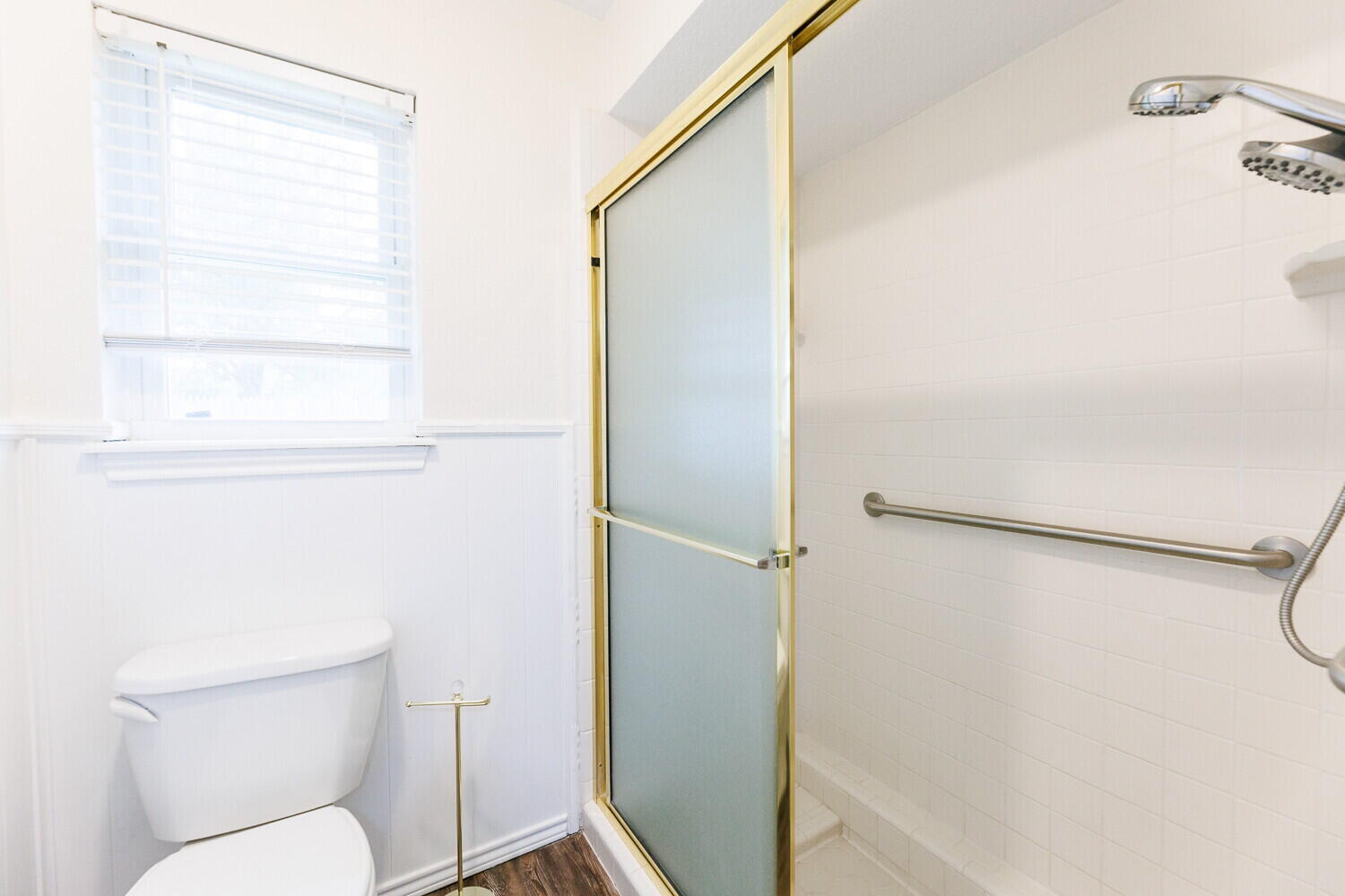 5703 80th Street Lubbock, TX 79424 - Photo 35 of 52 a bathroom with a toilet and a shower