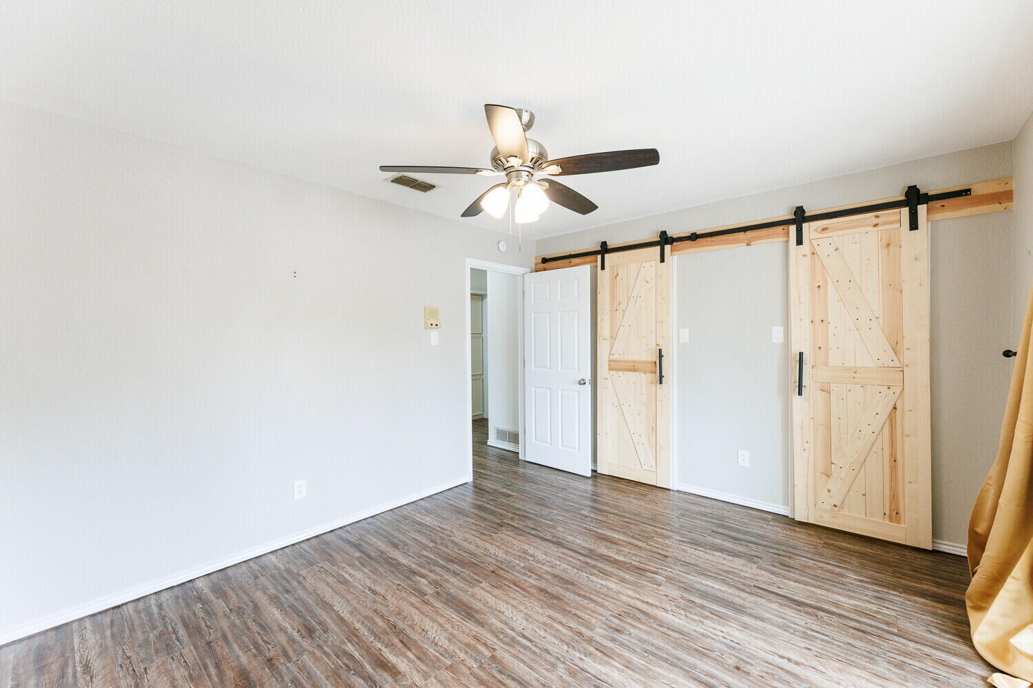 5703 80th Street Lubbock, TX 79424 - Photo 36 of 52 a view of an empty room with a window