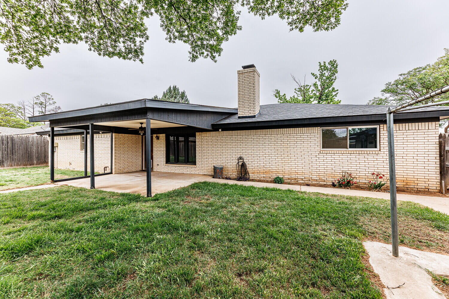 5703 80th Street Lubbock, TX 79424 - Photo 47 of 52 a house view with a garden space