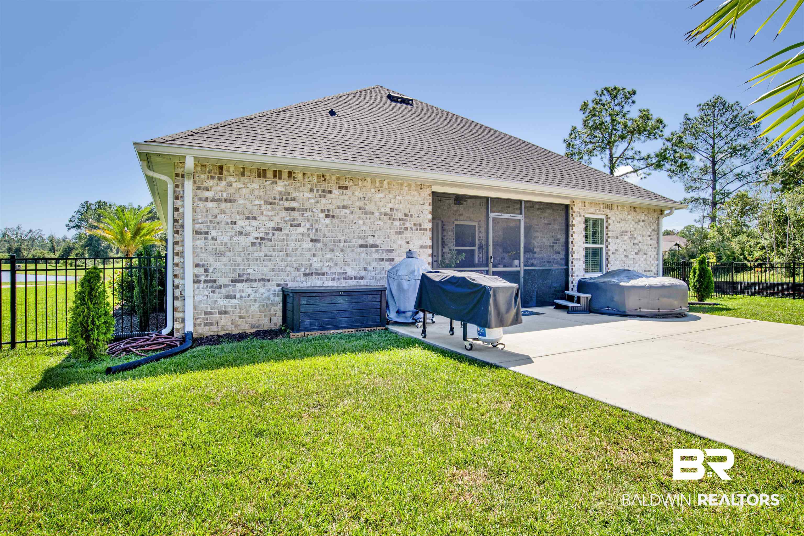 10113 Lakeview Drive Foley, AL 36535 - Photo 31 of 34 Exterior space featuring a lawn and a patio