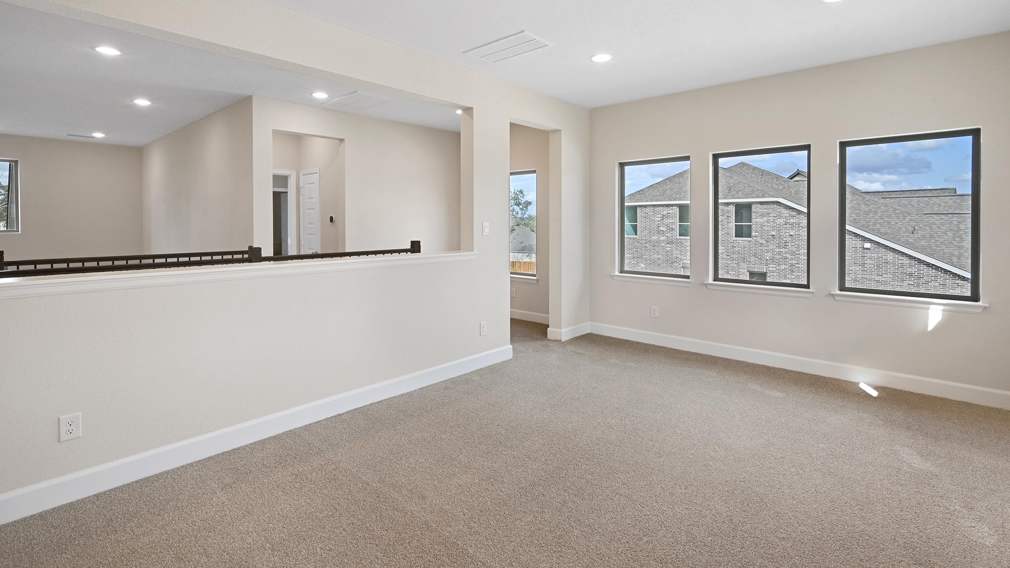 338 Prickly Poppy Loop Kyle, TX 78640 - Photo 22 of 40 Carpeted empty room featuring baseboards and recessed lighting