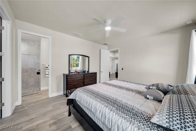 a bedroom with a bed and a dresser