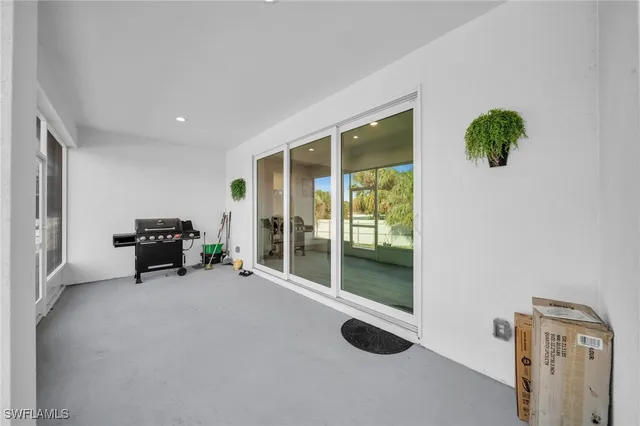 a view of livingroom with furniture and floor to ceiling window