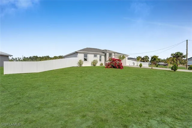 a view of a house with a big yard