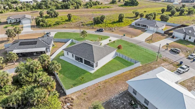 an aerial view of a house with outdoor space