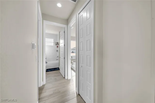 a view of a bathroom from a hallway