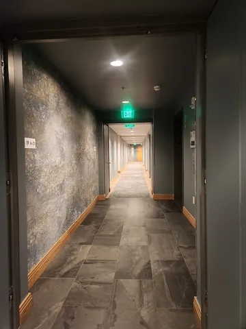a view of a living room with furniture window and wooden floor