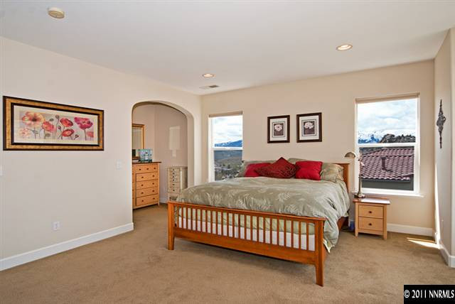 8541 Timaru Trail Reno, NV 89523 - Photo 11 of 13 a bed room with a bed and a window