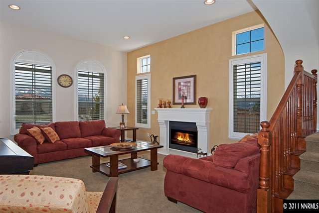 8541 Timaru Trail Reno, NV 89523 - Photo 3 of 13 a living room with furniture window and a fireplace