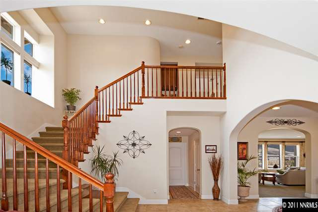 8541 Timaru Trail Reno, NV 89523 - Photo 4 of 13 a view of entryway with a front door and wooden floor