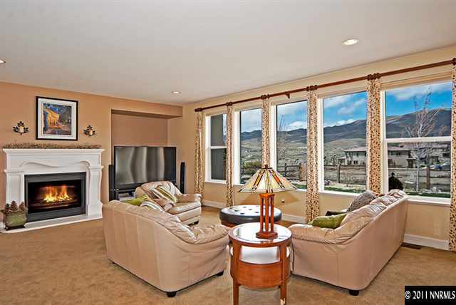 8541 Timaru Trail Reno, NV 89523 - Photo 8 of 13 a living room with furniture large window and a fireplace