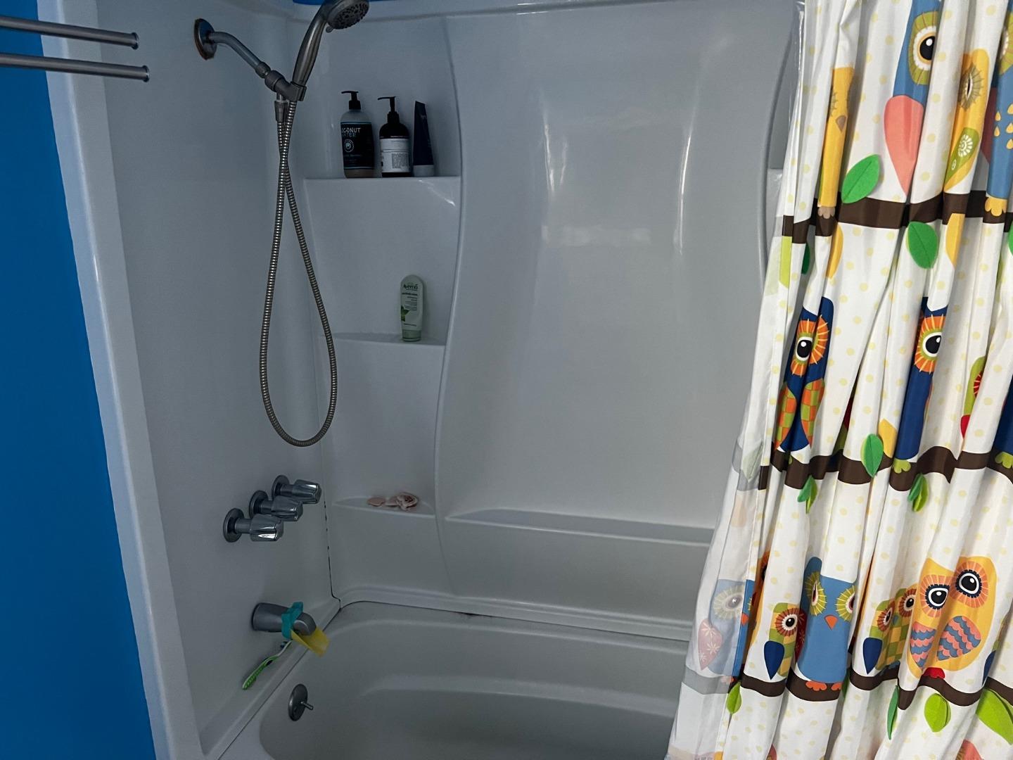 917 Channing Way Berkeley, CA 94710 - Photo 8 of 15 a bathroom with a shower and a sink