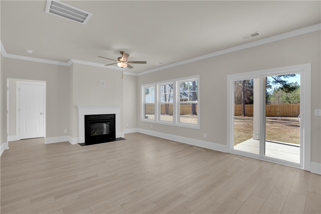 202 Bellflower Lane Pendleton, SC 29670 - Photo 14 of 38 This bright living area features clean lines and a charming fireplace.