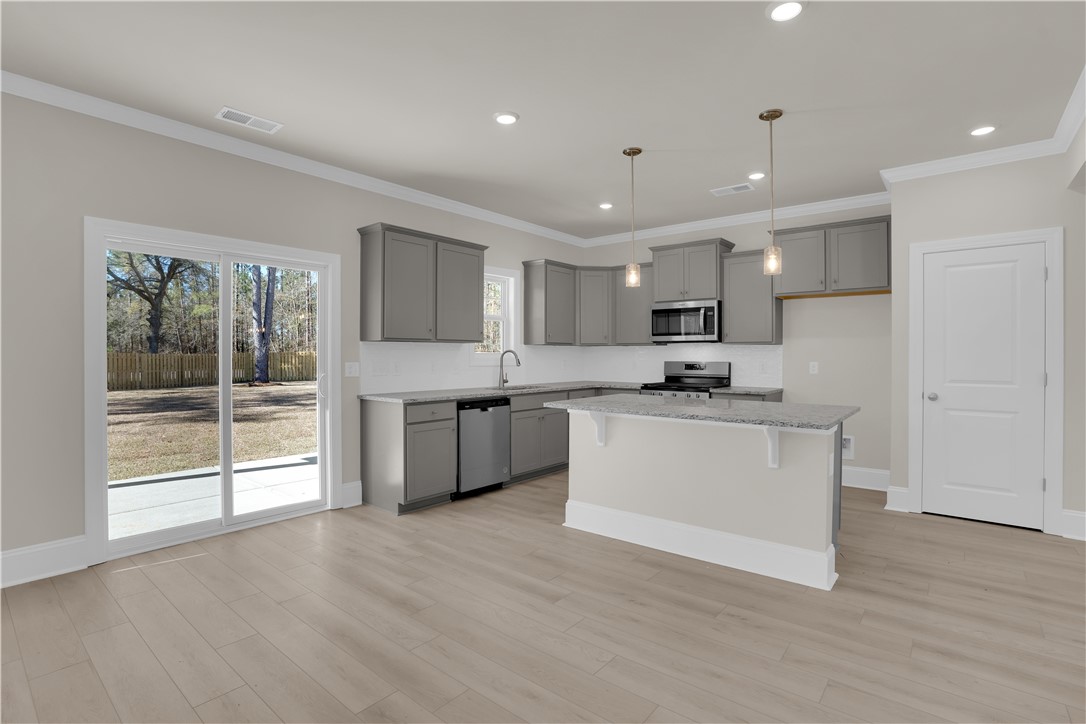 202 Bellflower Lane Pendleton, SC 29670 - Photo 15 of 38 This bright kitchen features sleek appliances, ample counter space, and a charming kitchen island.