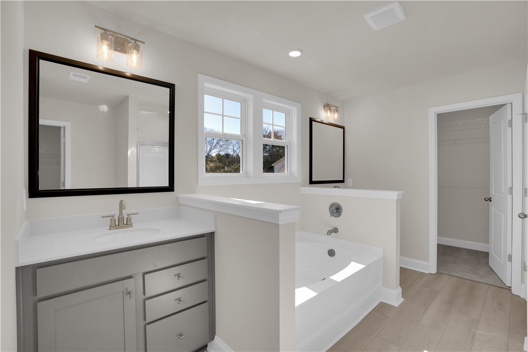 202 Bellflower Lane Pendleton, SC 29670 - Photo 24 of 38 Bright and airy, this spacious bathroom features modern fixtures and ample natural light.