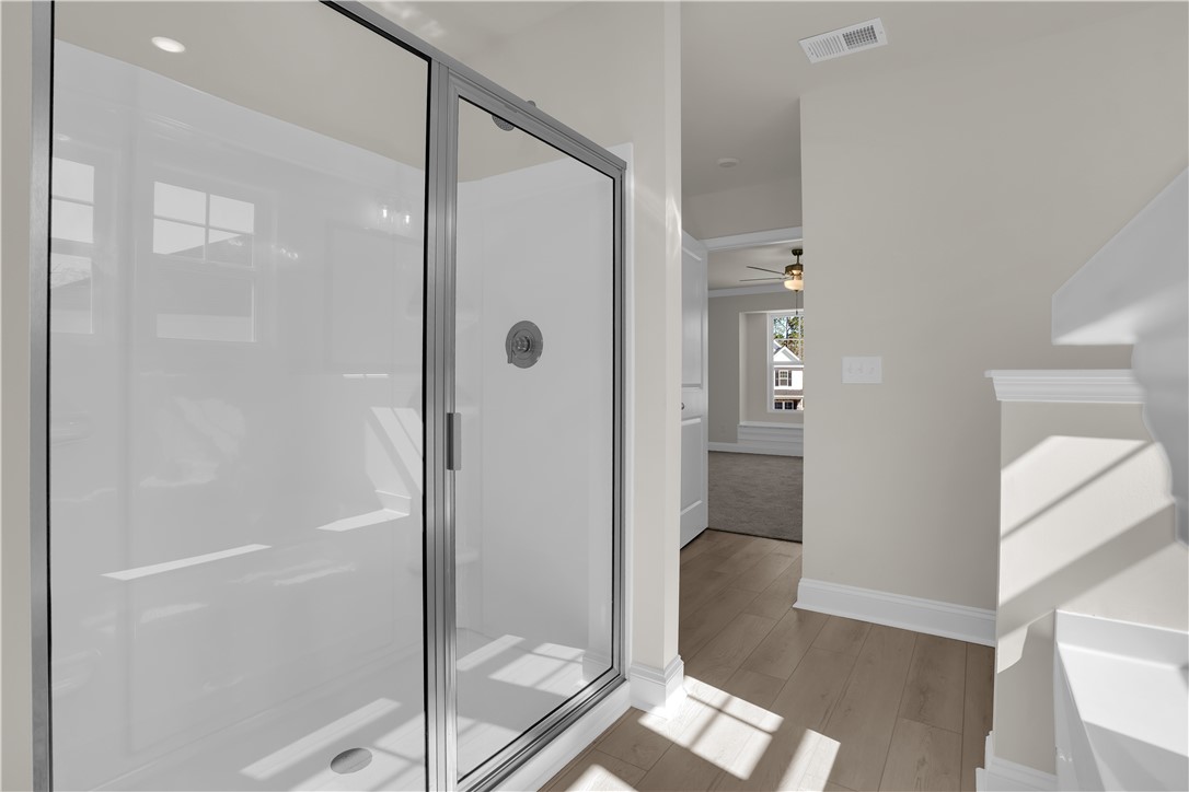 202 Bellflower Lane Pendleton, SC 29670 - Photo 27 of 38 This bright bathroom features a sleek glass-enclosed shower.