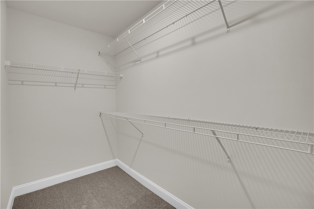 202 Bellflower Lane Pendleton, SC 29670 - Photo 28 of 38 This spacious walk-in closet features ample wire shelving for organized storage.