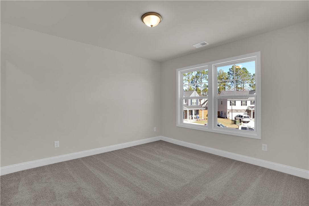 202 Bellflower Lane Pendleton, SC 29670 - Photo 30 of 38 This airy bedroom offers a tranquil retreat with plush carpeting and ample natural light.