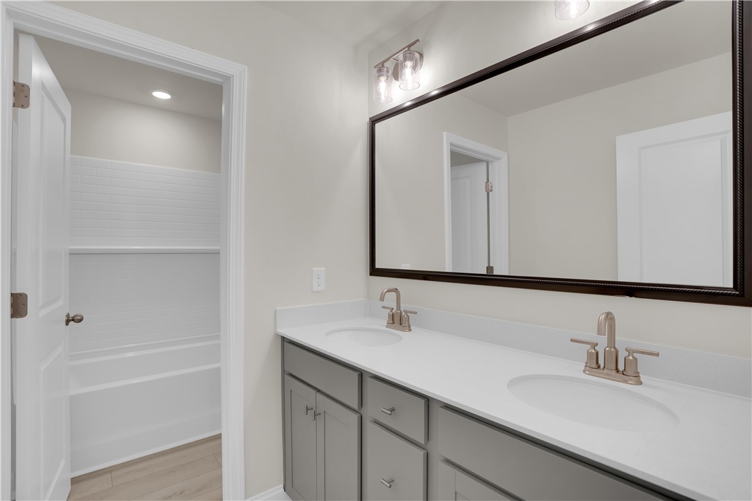 202 Bellflower Lane Pendleton, SC 29670 - Photo 32 of 38 This bright bathroom features a spacious vanity and a clean, inviting bathtub area.