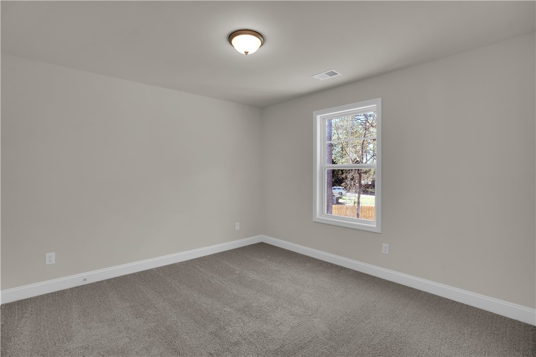 202 Bellflower Lane Pendleton, SC 29670 - Photo 35 of 38 Bright and airy, this room features ample natural light and plush carpeting.