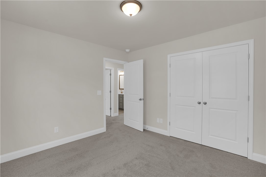 202 Bellflower Lane Pendleton, SC 29670 - Photo 36 of 38 This cozy bedroom offers a serene retreat with soft carpeting and convenient closet space.
