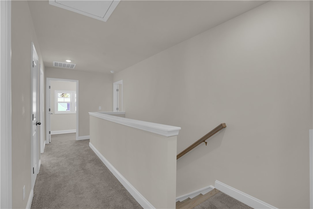202 Bellflower Lane Pendleton, SC 29670 - Photo 38 of 38 This bright hallway connects various rooms, offering a clear path to every part of the home.