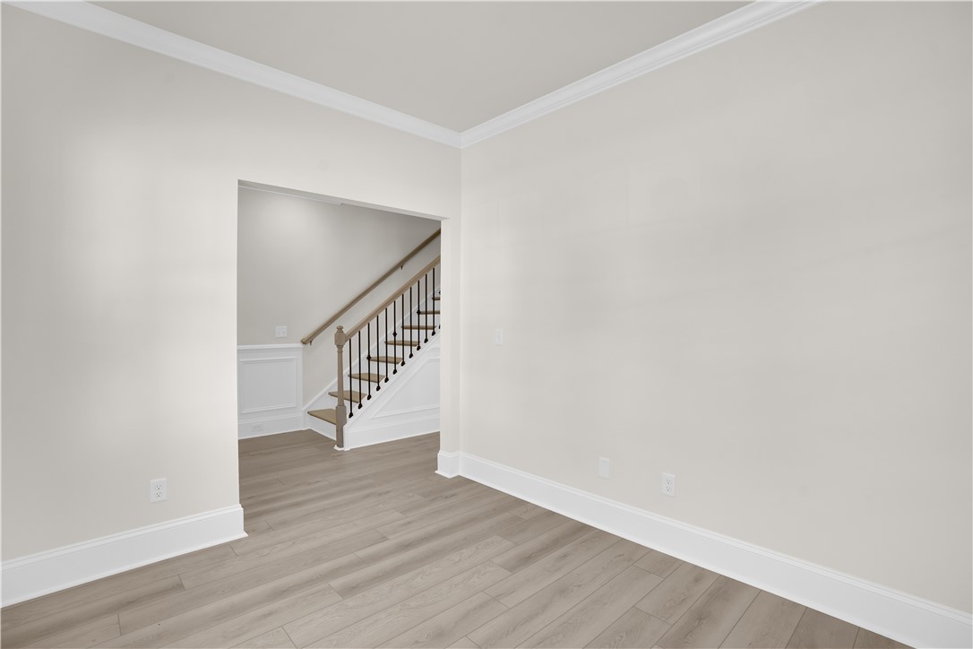 202 Bellflower Lane Pendleton, SC 29670 - Photo 6 of 38 This bright room features durable flooring and a stylish staircase.