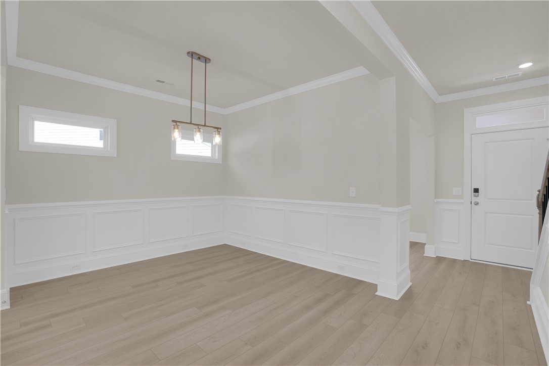 202 Bellflower Lane Pendleton, SC 29670 - Photo 8 of 38 This versatile room offers a refined aesthetic with durable flooring, ready for your personal touch.